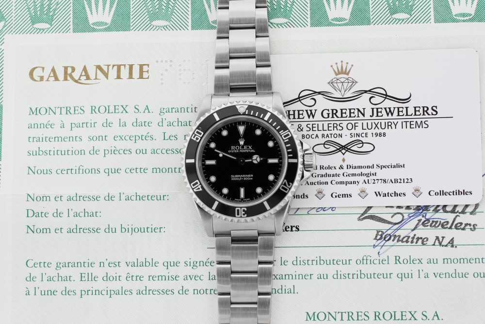 Rolex Steel Submariner 14060 with Box & Paper